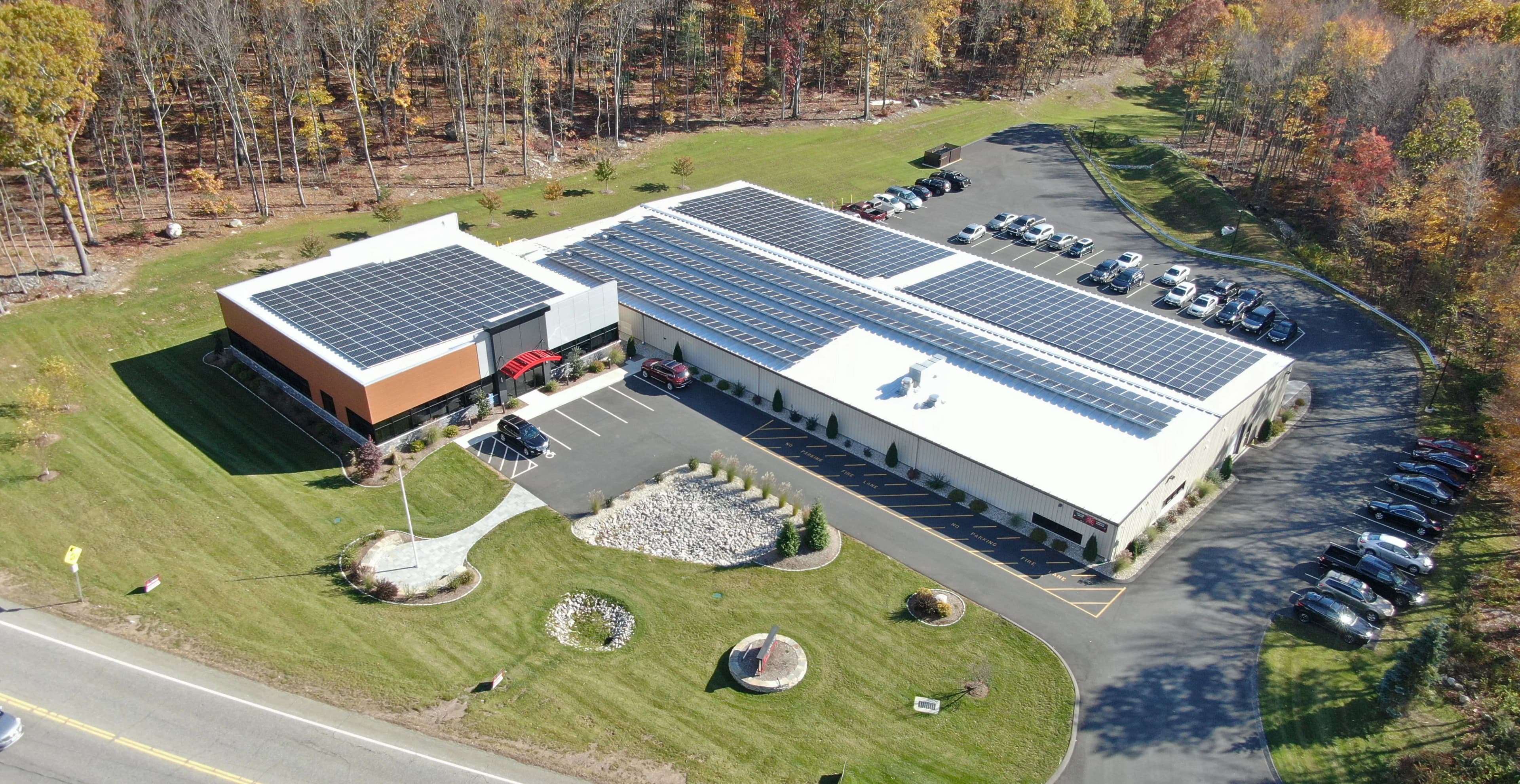 Aerial view of Able Coil's 2020 expansion facility with solar panels on roof